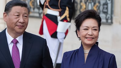 Chinese President Xi Jinping and his wife Peng Liyuan arrive for a state dinner at the Elysee Palace in Paris on Monday. EPA