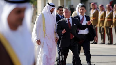 Sheikh Mohamed bin Zayed is welcomed by King Abdullah II at Queen Alia Airport in Amman, Jordan. Andre Pain / EPA