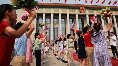 Children rehearse before the welcome ceremony for President Trump at the Great Hall of the People. Reuters