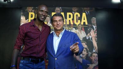 Candidate for presidency of Barcelona, Joan Laporta, right, poses with former Barcelona player Eric Abidal during a news conference on his plans for the football team. Lluis Gene / AFP