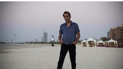 Oday Rasheed, the Iraqi director of Qarantina, relaxes on the beach. He came to see the premiere of his film last night.