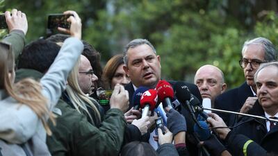 Greek Defence Minister Panos Kammenos, centre, is vehemently opposed to a deal with neighbouring Macedonia over the country's name. AP
