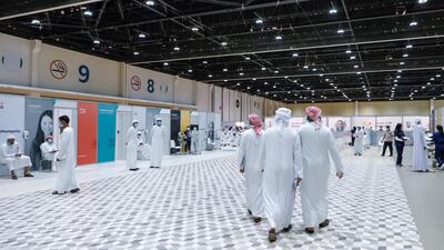 Volunteers wait to be screened and injected with the Covid-19 vaccine at Adnec. Victor Besa / The National
