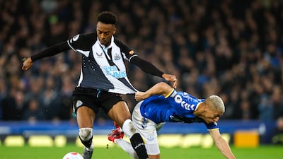 Newcastle's Joe Willock has his shirt pulled by Everton attacker Richarlison. PA