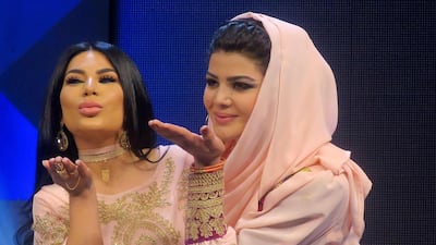 Aryana Sayeed, left, a judge of the television music competition Afghan Star, poses with competitor Zulala Hashemi in Kabul on March 9, 2017. Anne Chain / AFP