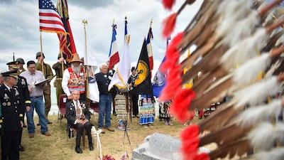 WWII US native American Indian veteran Charles Shay takes part with others in a ceremony on Omaha Beach in Saint-Laurent-sur-Mer, western France. AFP