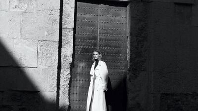 Dress, Dh732, Tommy x Zendaya by Tommy Hilfiger. Polo neck (worn underneath), Dh6,250; and trench coat, Dh15,000, both from Bottega Veneta. Trainers, Dh2,360, Valentino