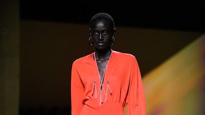 High-waisted trousers and shirt in tangy orange at Hermes spring-summer 2023. AFP