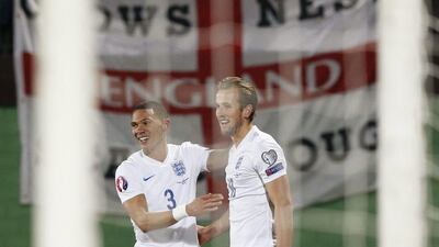 England’s Harry Kane celebrates with Kieran Gibbs after forcing an own goal for England’s second score against Lithuania on Monday night in Euro 2016 qualifying. Carl Recine / Action Images / Reuters