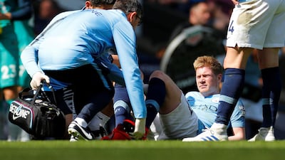 Manchester City's Kevin De Bruyne receives medical attention after sustaining an injury. Reuters