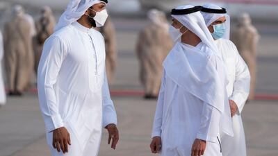 Sheikh Hazza bin Zayed, vice chairman of the Abu Dhabi Executive Council, receives Sheikh Nasser bin Hamad bin Isa Al Khalifa (L), at the Presidential Airport ---
