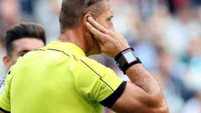 Referee Nestor Pitana receives instructions from a video assistant referee to disallow a goal of Portugal due to offside during the FIFA Confederations Cup Group A match against Mexico at Kazan Arena, in Kazan, Russia, 18 June 2017. EPA