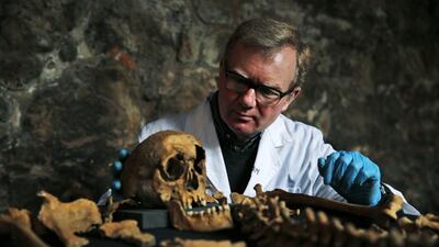 Don Walker, a human osteologist with the Museum of London with one of the skeletons found by construction workers under central London’s Charterhouse Square. 25 skeletons thought to be from a grave for victims of the Black Death were uncovered last year during work on Crossrail, a new rail line that’s boring 20km of tunnels under London. Lefteris Pitarakis / AP Photo March 26