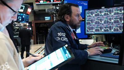 Traders at the New York Stock Exchange. Money markets expect the Fed to switch into rate-cutting mode by the end of 2023. AFP