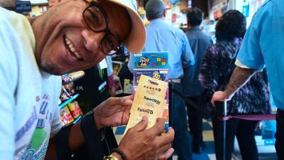 American, Berg Beteda, tries his luck by buying a lottery ticket in Los Angeles last week. An unnamed winner later won the Mega Millions jackpot. Photo: AFP