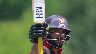 CP Rizwan raises his bat after reaching 50 for UAE against United States in Texas.