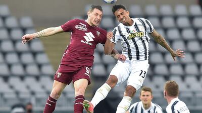 Torino's Andrea Belotti and Juventus' Danilo in action. EPA