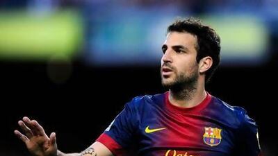 New coach Gerardo Martino wants to stop all the talk of Cesc Fabregas, above, leaving Barcelona. David Ramos / Getty Images