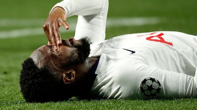 Danny Rose of Tottenham lies on the pitch following a tackle. EPA