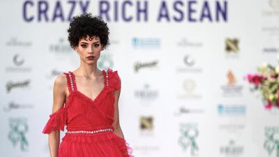 Fashion by Filipino designers Jose and Aldwin Guardiana.