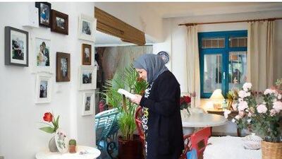 Lamya'a from Kuwait looks at the photos of Fatmagul on the walls of Gul Mutfagi where the soap was shot.