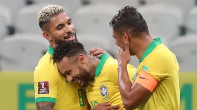 Neymar celebrates with teammates Douglas Luiz and Thiago Silva. AFP