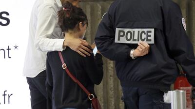 A relative of the victims of the EgyptAir flight 804 is escorted at Charles de Gaulle Airport. Egyptian military aircraft and navy ships were taking part in a search operation off Egypt’s Mediterranean coast to locate the debris of the plane. Michel Euler / AP