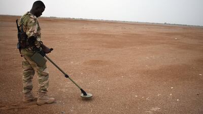 A Sudanese soldier, stationed in Yemen as part of the Arab Coalition, checks for mines in a exercise near Al Mokha, eastern Yemen. Gareth Browne/The National