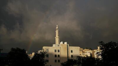A rainbow is seen over a closed mosque during the first day of Eid Al Fitr after the government imposed a full lockdown in Amman, Jordan. Reuters