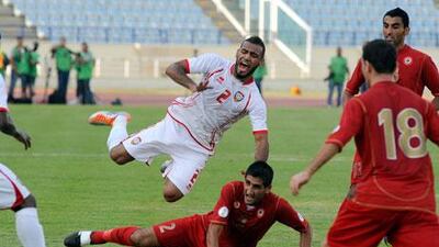 The UAE's Khalid Sabeel, top, visibly wincing following a heavy challenge from a Lebanon defender. Bruno Metsu, the former Emirates coach, had said when leaving his post in 2008 that national players are 'not physically strong' and hinted they lack fighting spirit when they are behind in matches. Wael Hamzeh / EPA