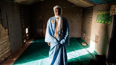 The Imam of a makeshift mosque and school poses for a portrait in the informal settlement of Tarhil on the outskirts of Nouakchott, Mauritania. AFP