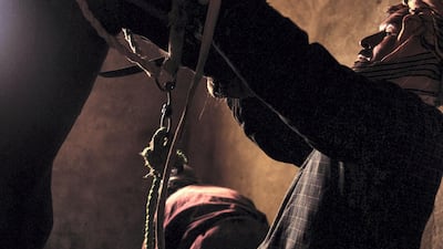 A stable hand inspects a horse ahead of the match. A prized bozkashi horse can range from $30,000 to $50,000.