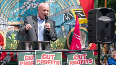 Mick Lynch, RMT general secretary, addresses rail workers and travellers at a rally outside Kings Cross Station in London on June 25. PA