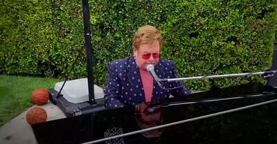 Elton John performed al fresco, seemingly on a basketball court. YouTube