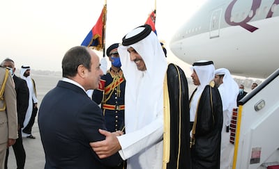 Egyptian President Abdel Fattah El Sisi welcomes Qatar's Emir Sheikh Tamim as he arrives in Cairo. Egyptian Presidency / EPA