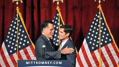 Mitt Romney, left, with his son Matt at a fundraiser in California last month. Mandel Ngan / AFP