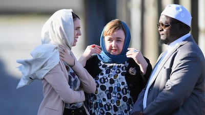 Ms Ardern, Greater Christchurch Regeneration Minister Megan Woods, centre, and Imam Alabi Lateef Zirullah chat as they wait for the arrival of Prince William at Linwood Mosque. Getty Images