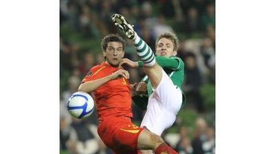 Ireland's Kevin Doyle, right, was injured against Macedonia on Saturday night. Peter Muhly / AFP