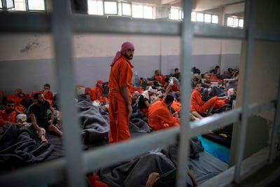 Alleged ISIS fighers in a Kurdish prison in Syria. Several British MPs have written to the Boris Johnson government to 'not wash its hands' of the 40 Britons detained in the war-torn country. AFP