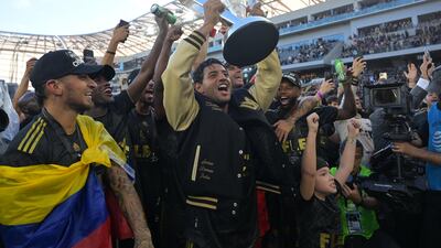 Los Angeles FC forward Carlos Vela celebrates with the Philip F Anschutz Trophy. USA Today