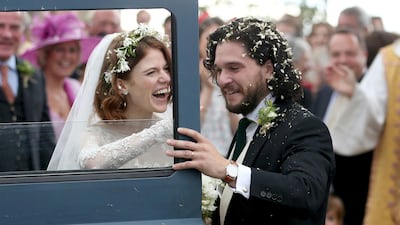 Former Game of Thrones co-stars Kit Harington and Rose Leslie married near the bride's family castle in Scotland. Jane Barlow / PA via AP