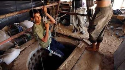 A Palestinian youth prepares to enter a smuggling tunnel which links Egypt and the southern Gaza Strip border town of Rafah on June 21, 2010 following an Israeli announcement it would allow into the Hamas-ruled Palestinian territory everything that cannot be used by Gaza's Hamas rulers to build weapons or fortifications, dealing a potentially fatal blow to the tunnel trade that has largely sustained the coastal enclave.