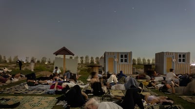 Visitors to the event lie in wait for the meteor sightings. Dubai Astronomy Group hosted event in the Al Khatim Desert in Abu Dhabi. Antonie Robertson/The National