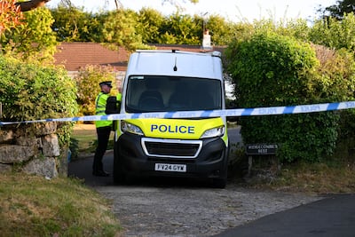 A police officer stands outside the house of Ann Widdecombe in Haytor in Dartmoor, United Kingdom. Getty Images