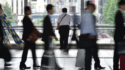 People cross a concourse in Tokyo. Kazuhiro Nogi/AFP