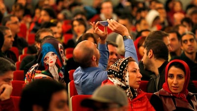 Iranian women wait for the start of a concert by French drummer and songwriter Manu Katche at Vahdat Hall in Tehran on January 18, 2018. Atta Kenare / AFP
