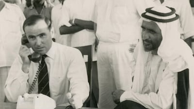 Watched by Sheikh Rashid, the British political resident, Donald Hawley, inaugurates Dubai's telephone service on July 29, 1960. Lady Ruth Hawley