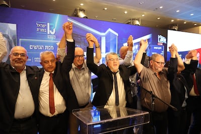 Head of the mostly Arab Joint List alliance Yousef Jabareen, centre, celebrates with supporters as the first exit polls are announced in Nazareth. EPA