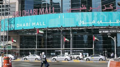 Pedestrians run across the busy road in front of Abu Dhabi Mall after the footbridge bridge was removed as part of construction works. Mona Al Marzooqi / The National