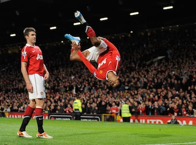 Nani with his trademark celebration after scoring a late goal against Tottenham at Old Trafford in October 2010. Getty